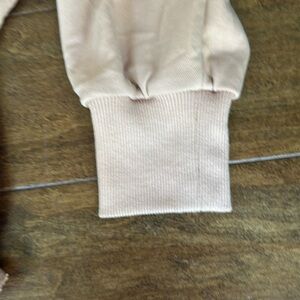 good condition womens quarter zip sinch jacket with small stain as seen in photo